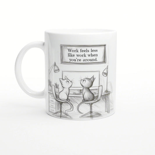 Sketch-style mug featuring two cats at a desk with a framed quote: 'Work feels less like work when you're around'.