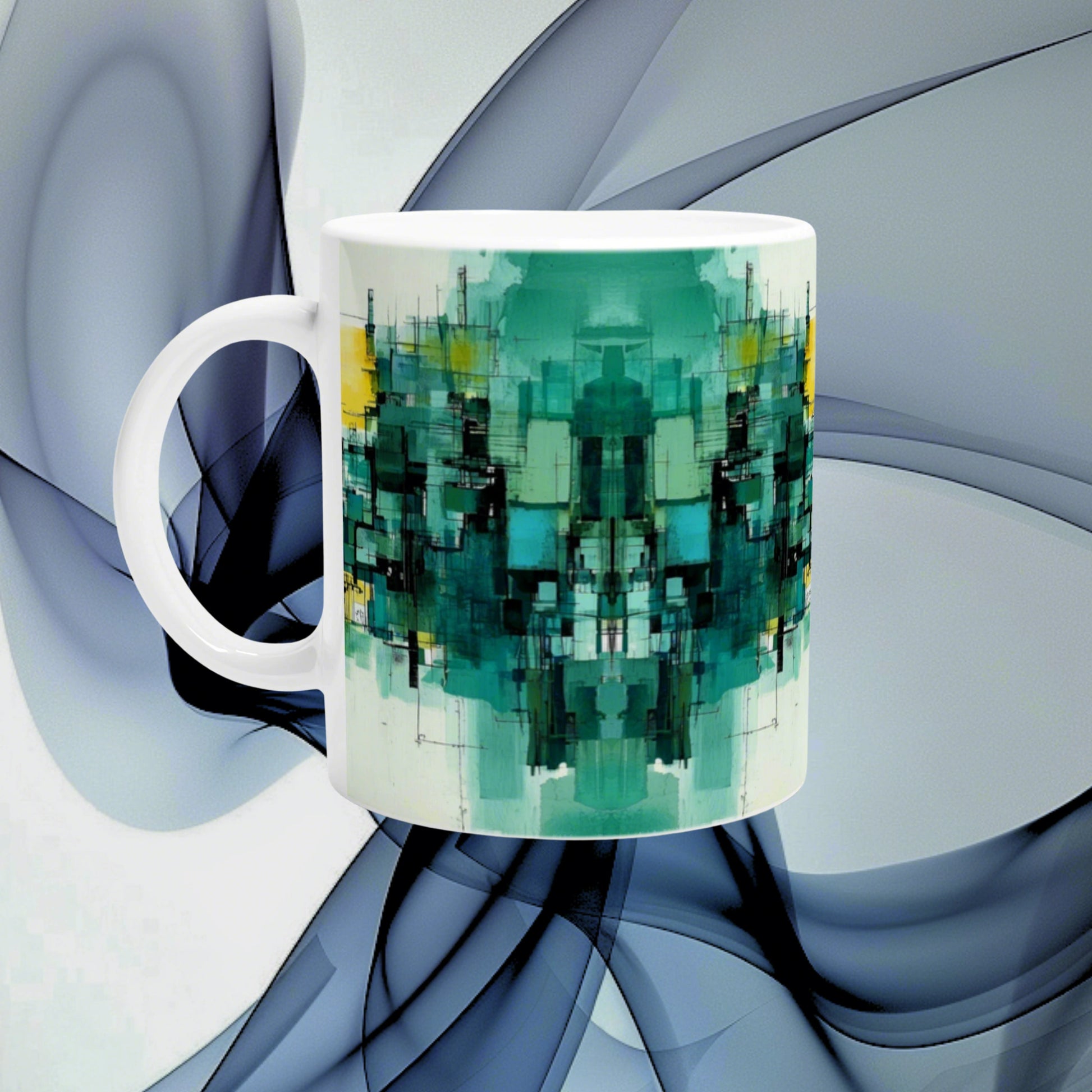 White ceramic mug with a teal-green abstract geometric print, shown as a product mockup against a blue background.