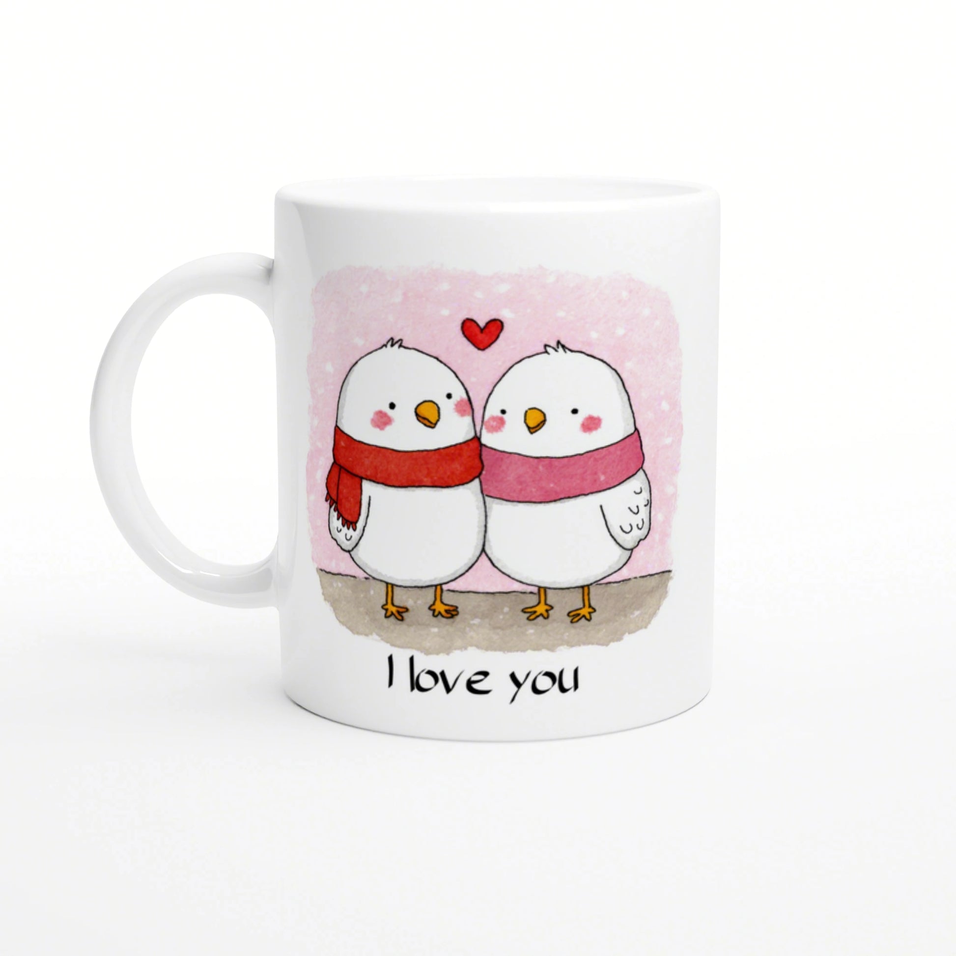 Mockup mug depicting two white birds in scarves on a pink background with the caption 'I love you'.