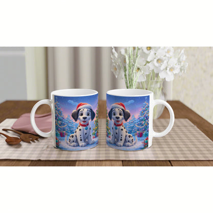 Pair of ceramic mugs featuring a cute Dalmatian puppy in a snowy Christmas scene with a Santa hat, on a wooden table.