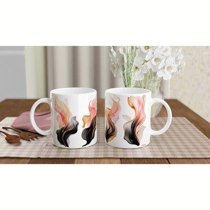 Product mockup: two white ceramic mugs with abstract pink, peach, gold, and black swirls on a wooden table.