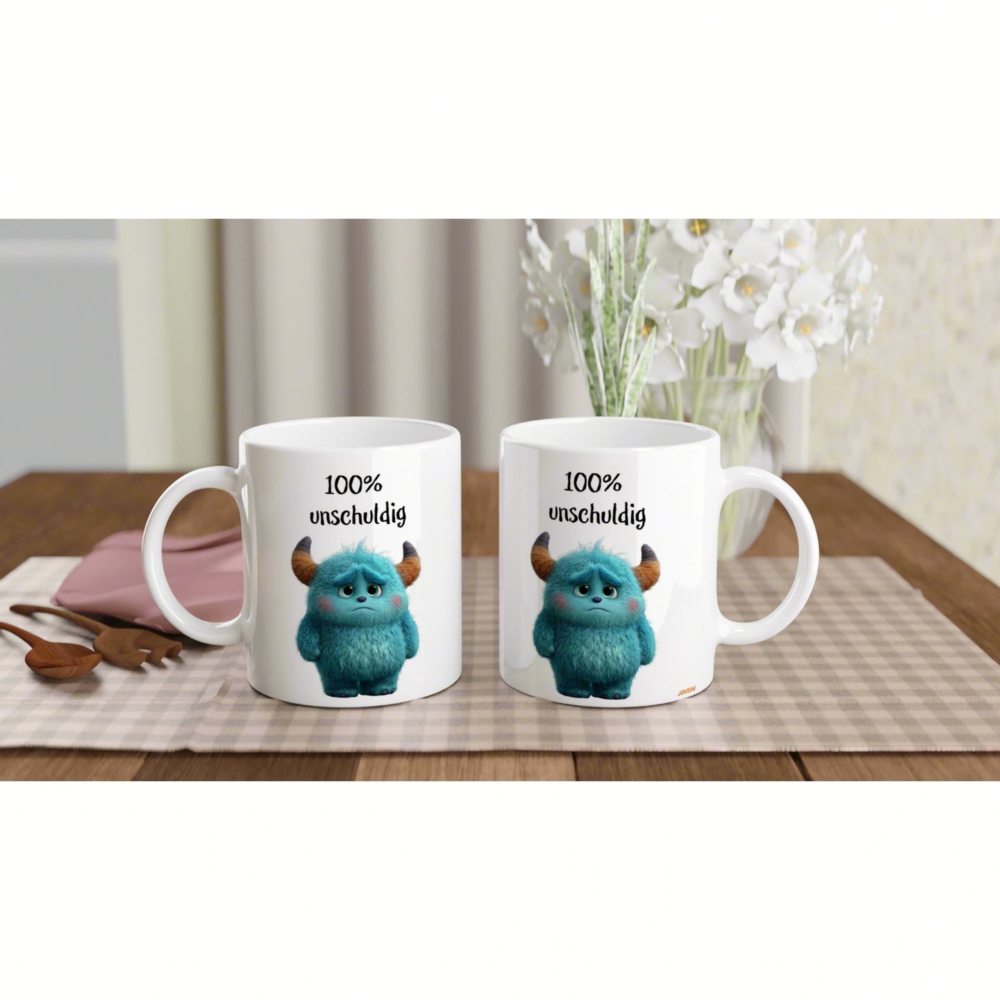 Two white ceramic mugs on a wooden table, each featuring a blue fuzzy monster and the text '100% unschuldig' — product mockup for funny slogans.