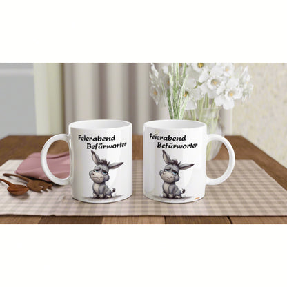 Product mockup: two white mugs on a wooden table featuring a cartoon donkey and the text Feierabend Befürworter.