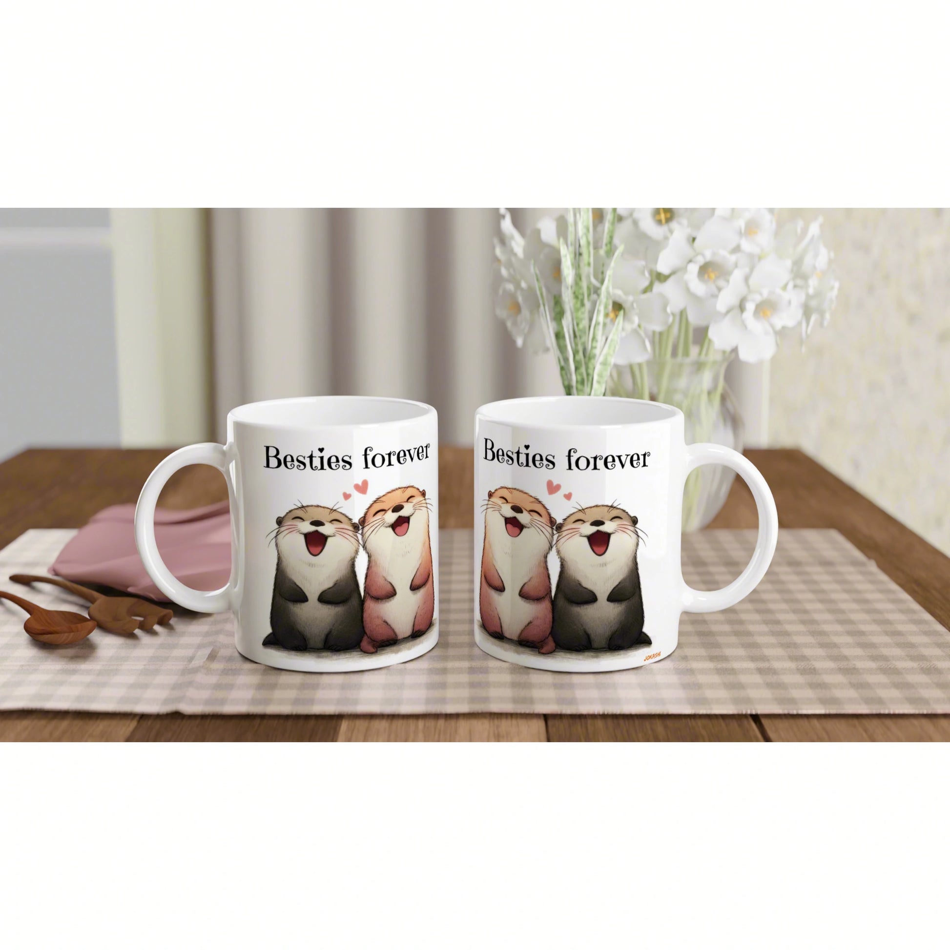 Two white mugs with cartoon otters and the text Besties forever on a wooden table (product mockup).