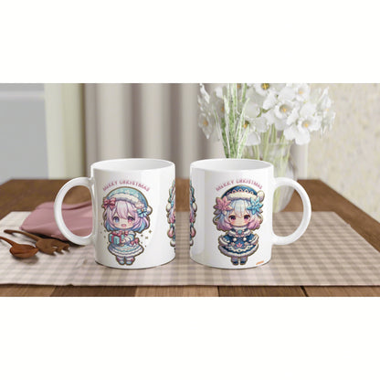 Two white mugs with kawaii chibi Christmas girls and Merry Christmas text on checkered placemat with a vase of white flowers.