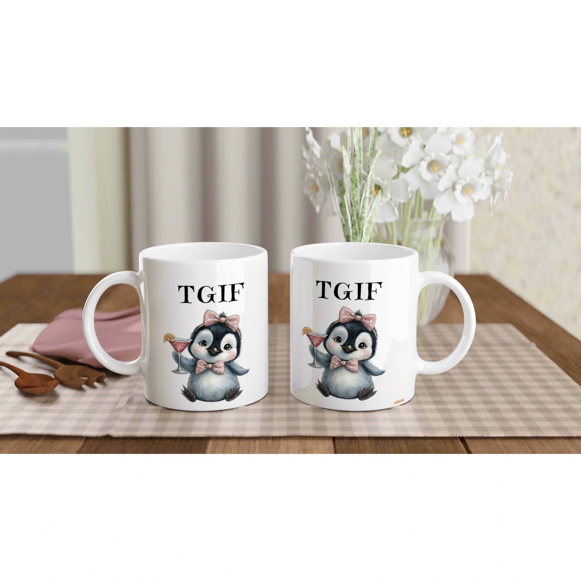 Two white mugs on a wooden table, each with a cute penguin wearing a pink bow, holding a cocktail, and TGIF text.