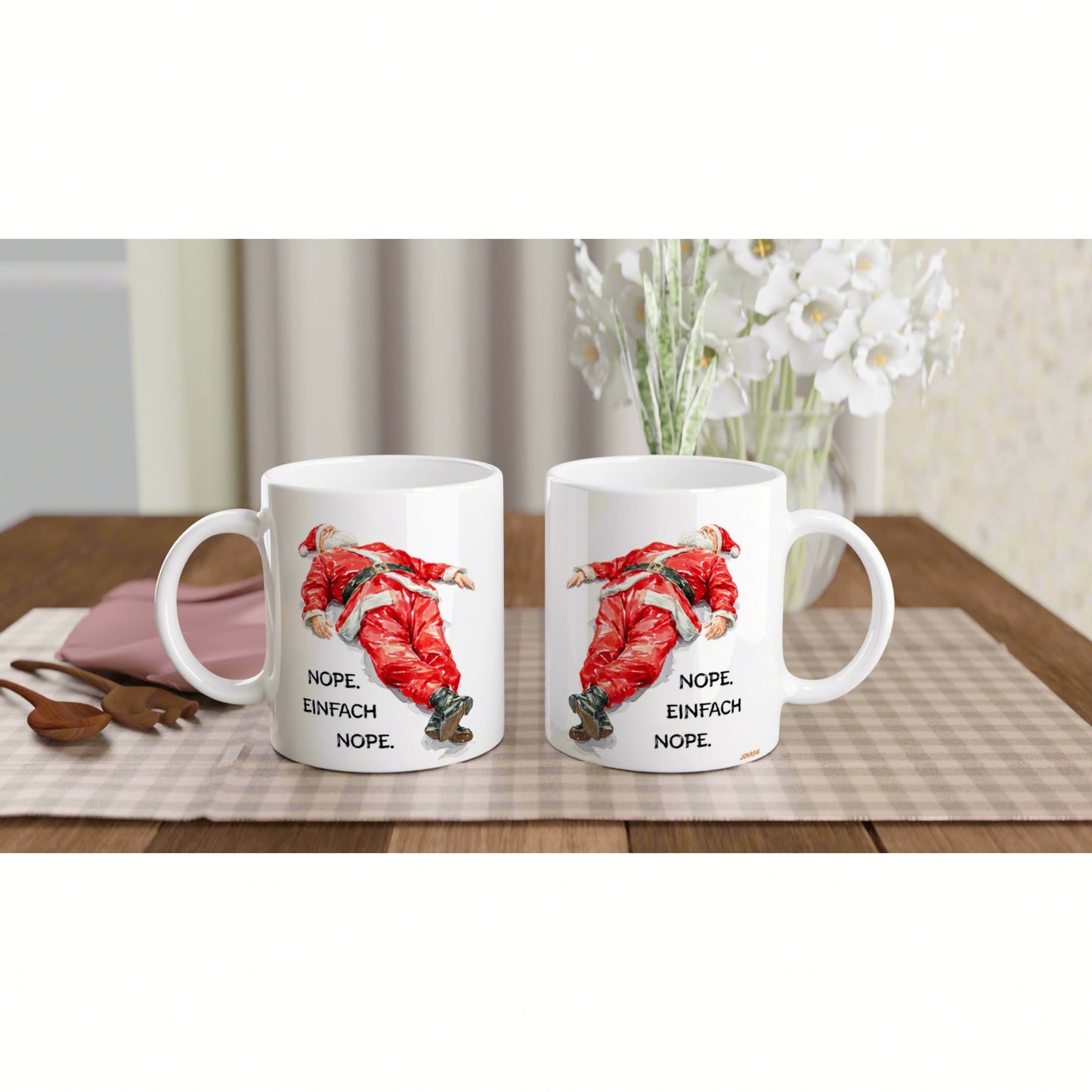 Two white mugs on a wooden table feature a red Santa illustration and the caption 'NOPE. EINFACH NOPE.' — product mockup.