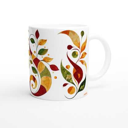 White ceramic mug featuring a vibrant abstract autumn leaf pattern in red, orange, yellow, and green.