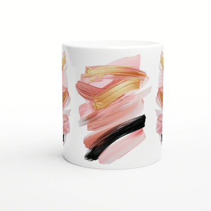 White ceramic mug with an abstract brush-stroke design in pink, gold, and black, shown as a product mockup.