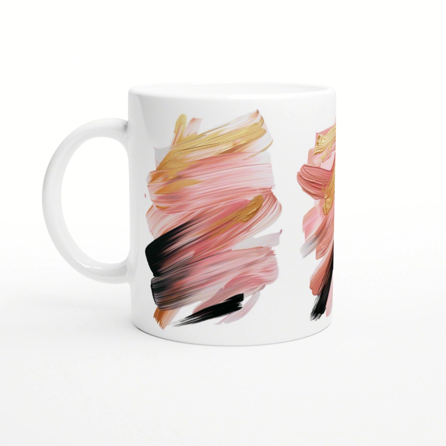 White ceramic mug featuring abstract brushstroke artwork in pink, peach, gold, and black.