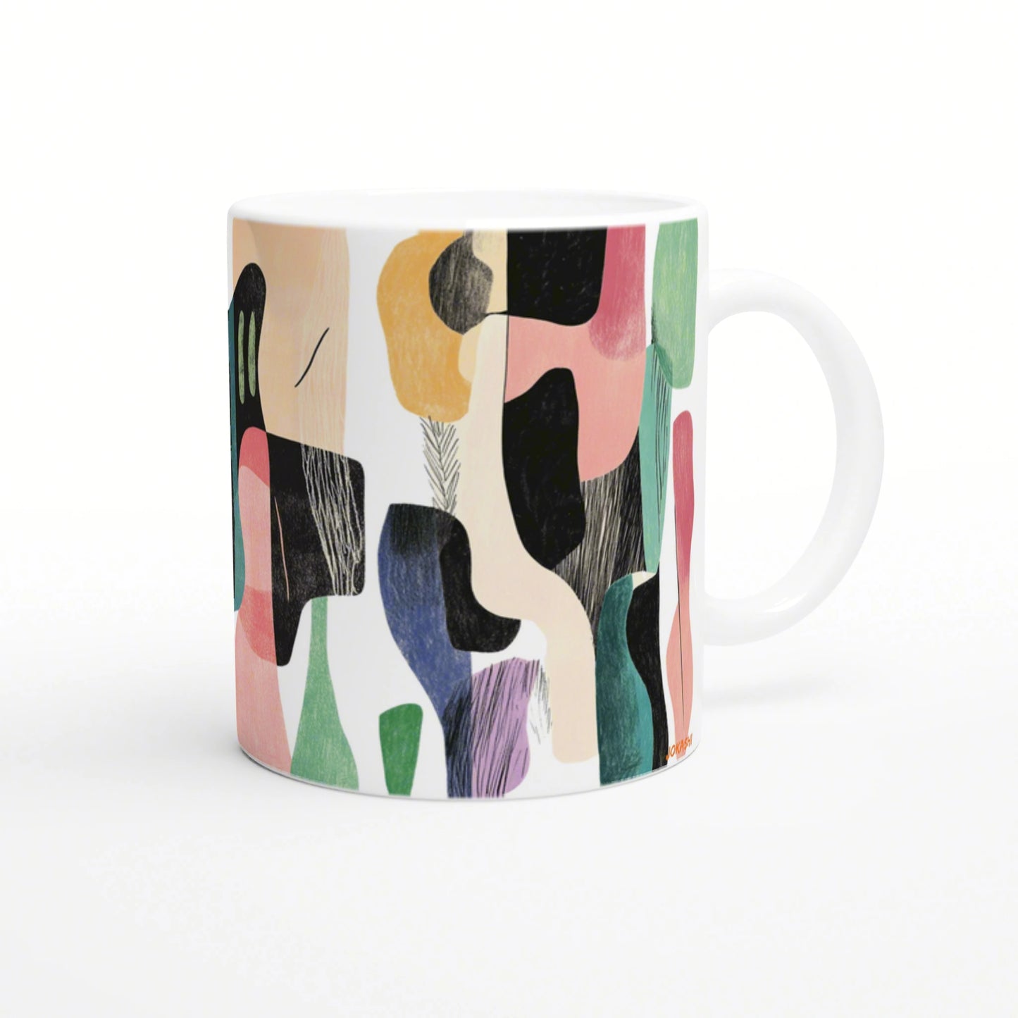 White ceramic mug featuring a vibrant abstract collage pattern in peach, black, pink, green, and blue.