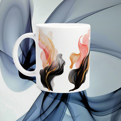 White ceramic mug mockup with flowing orange, pink and black feather-like swirls.