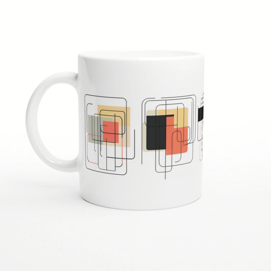 White ceramic mug with abstract geometric pattern of overlapping squares and rounded rectangles in red, orange, beige, black.