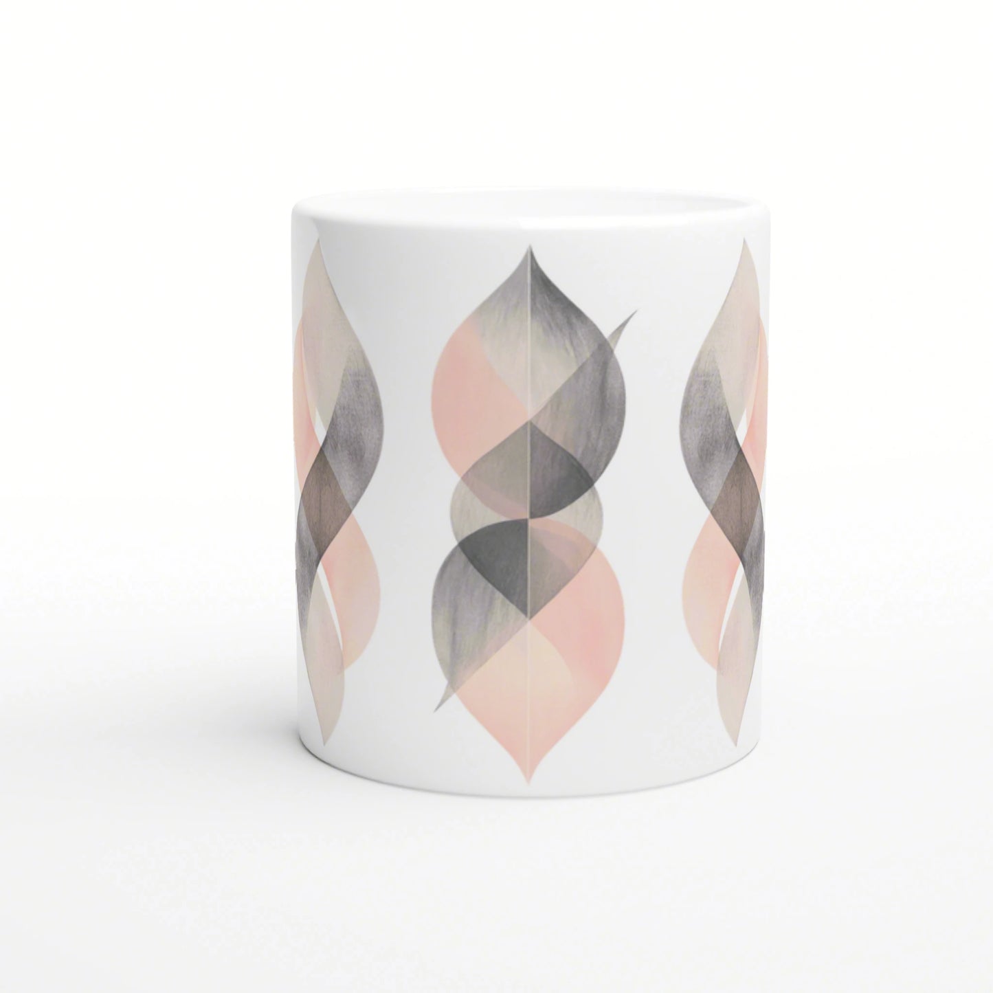White ceramic mug featuring a repeating abstract leaf pattern in gray and peach tones; a product mockup.