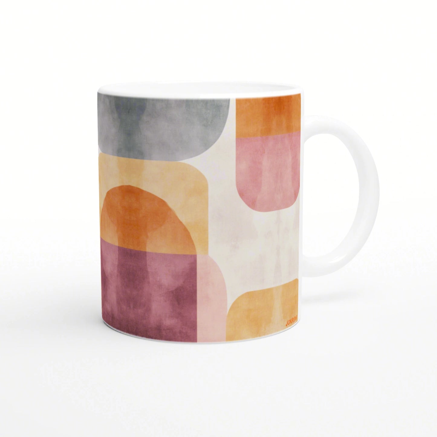 Product mockup: white ceramic mug with an abstract pastel geometric pattern in orange, pink, yellow, and gray.