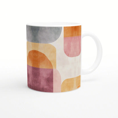 Product mockup: white ceramic mug with an abstract pastel geometric pattern in orange, pink, yellow, and gray.