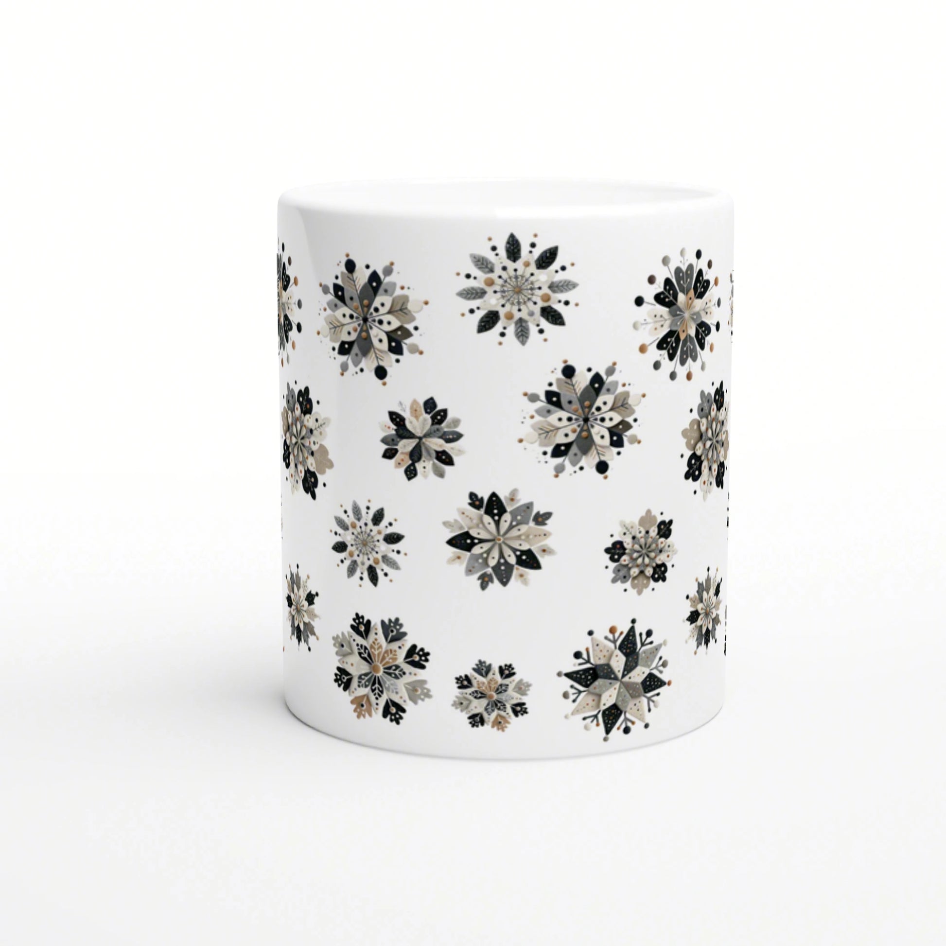 White ceramic mug with a repeating black, gray and beige floral snowflake pattern; product mockup.