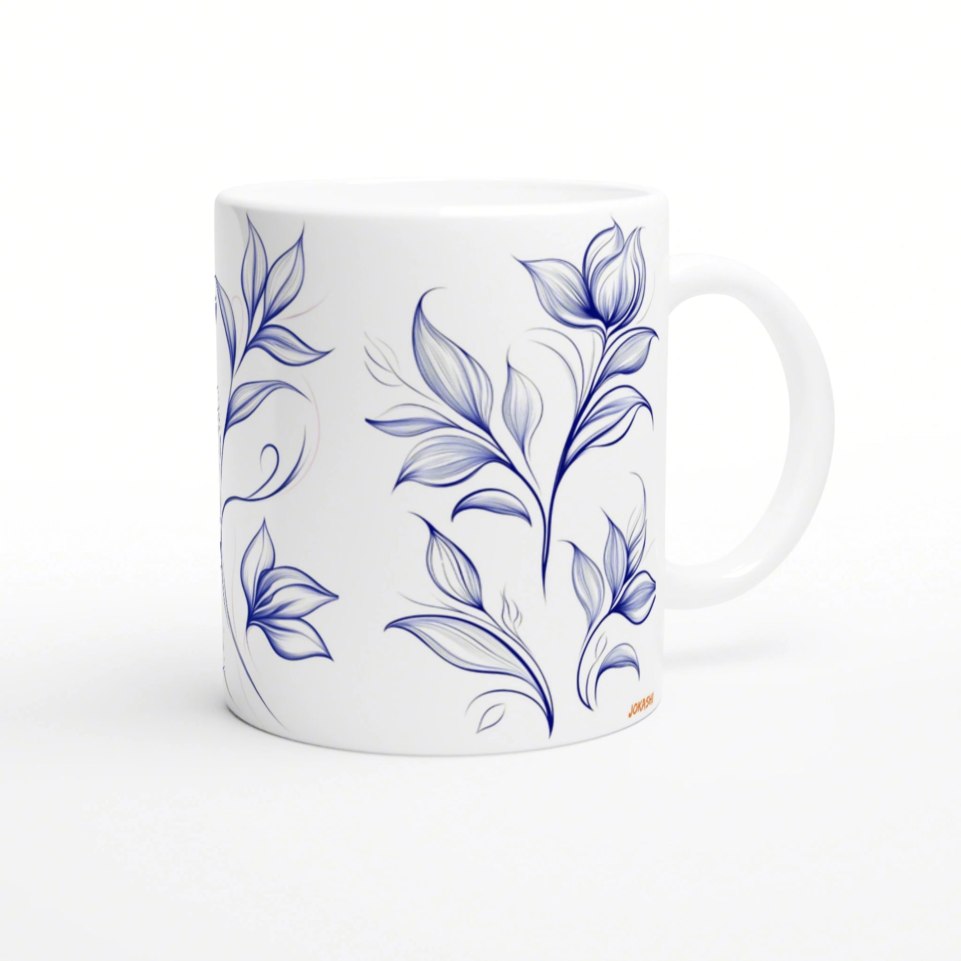 White ceramic mug with a blue botanical floral pattern wrapping around the surface.