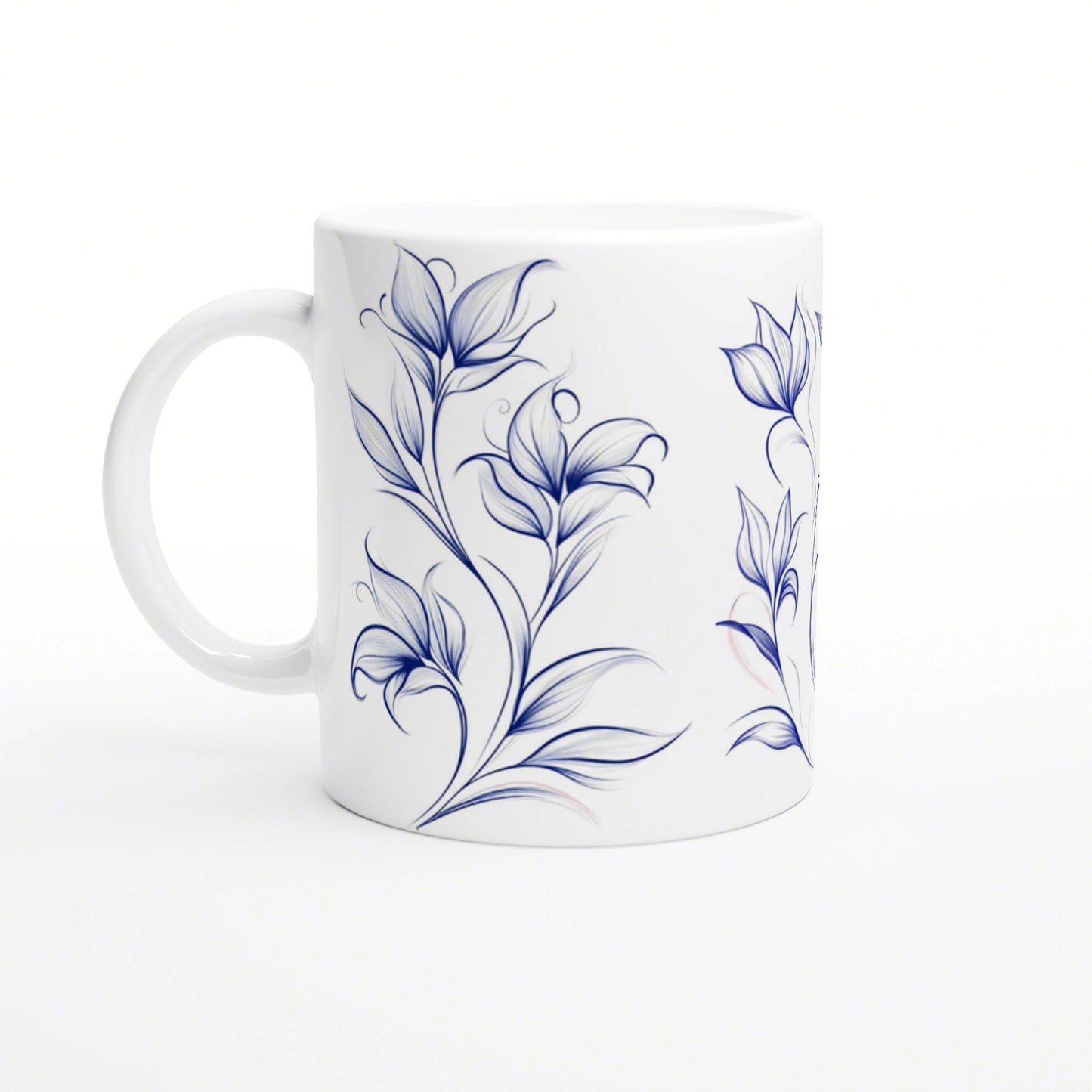 White ceramic mug with blue floral vine design; product mockup, handle on the left.