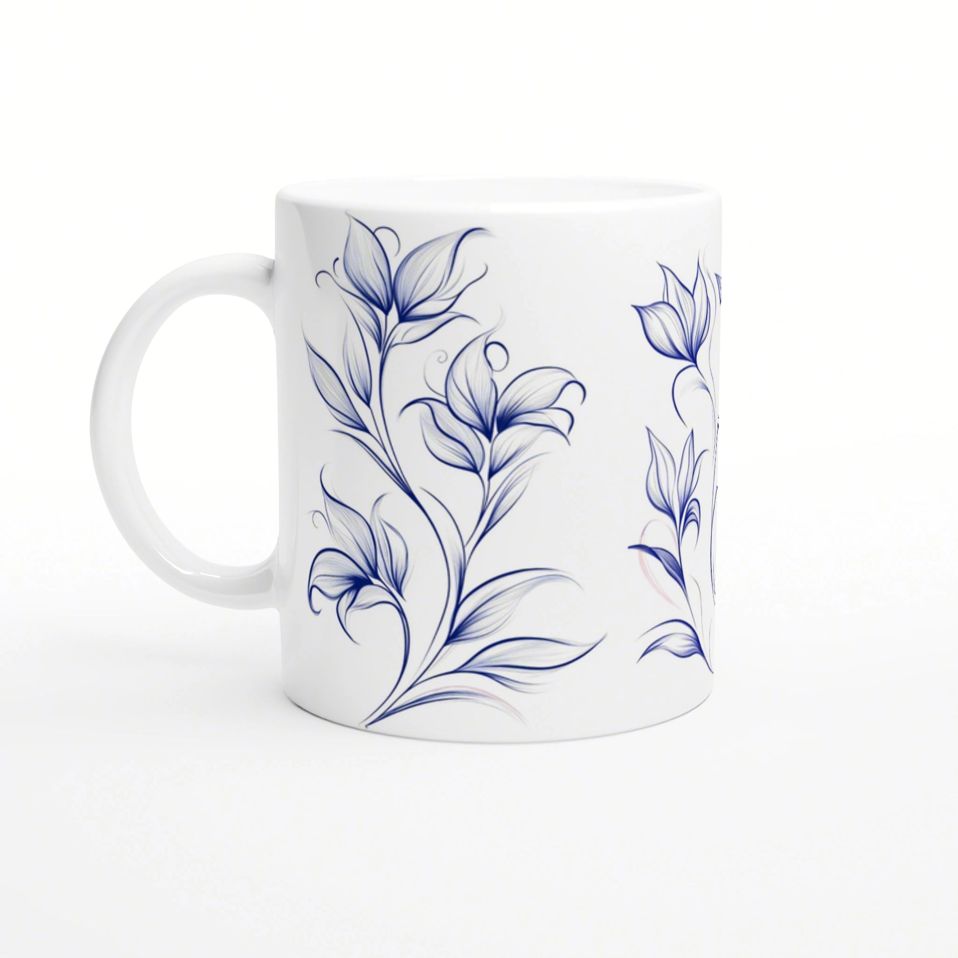 White ceramic mug with blue floral vine design; product mockup, handle on the left.