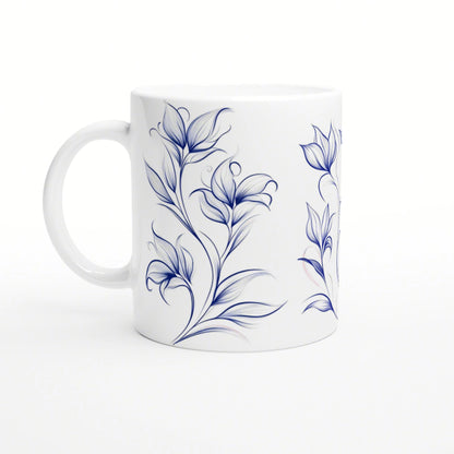 White ceramic mug with blue floral vine design; product mockup, handle on the left.