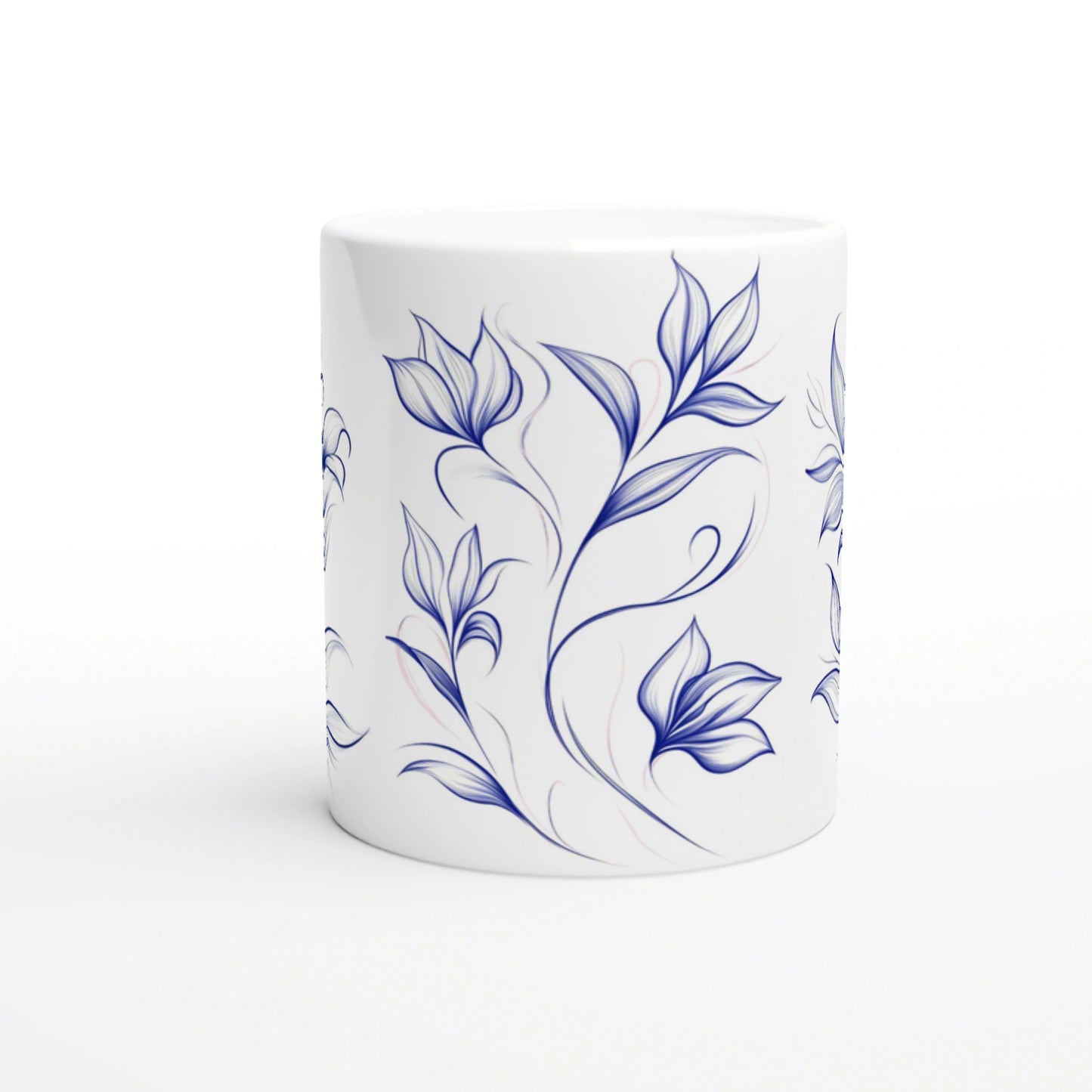 White ceramic mug with a blue hand-drawn floral vine pattern wrapping around.