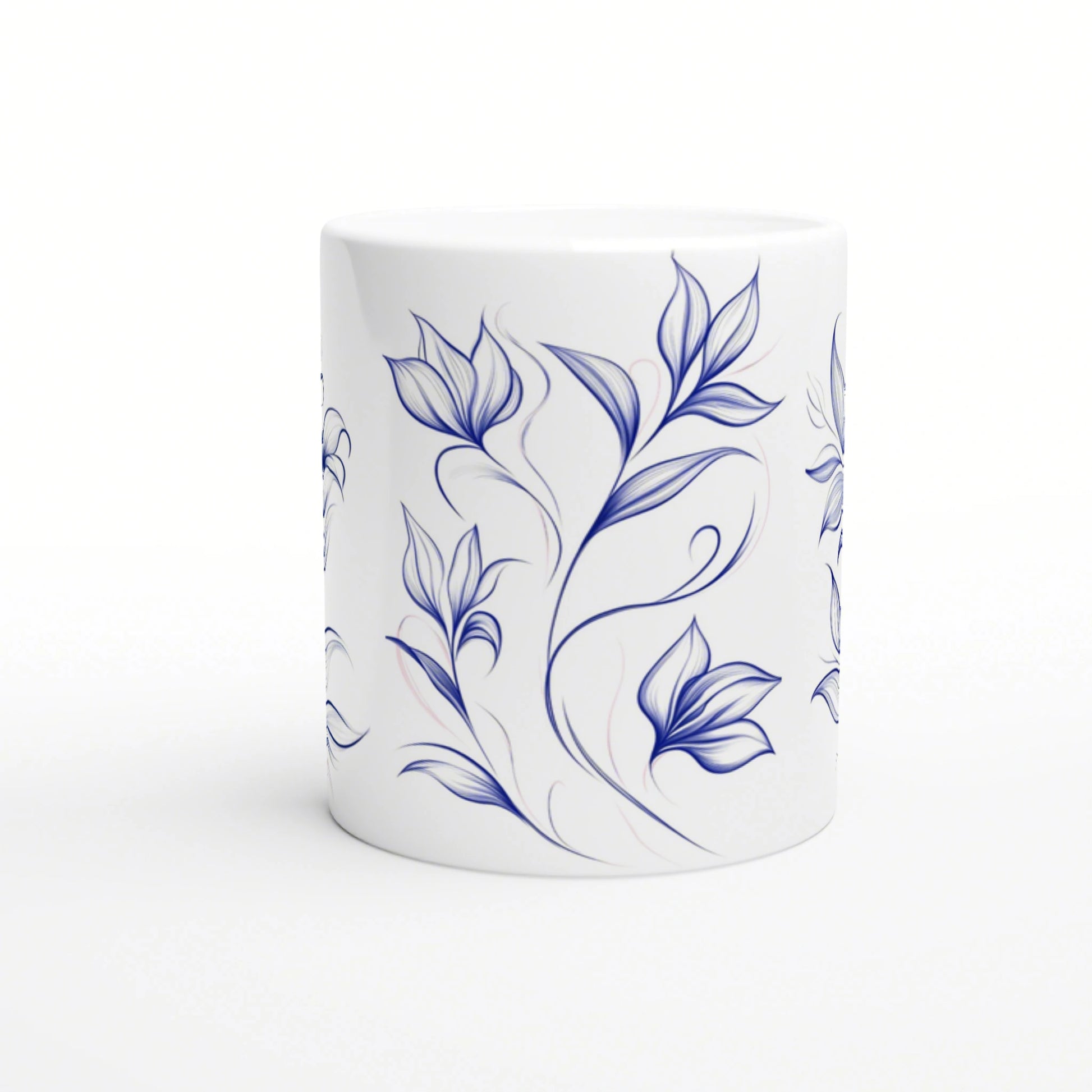 White ceramic mug with a blue hand-drawn floral vine pattern wrapping around.