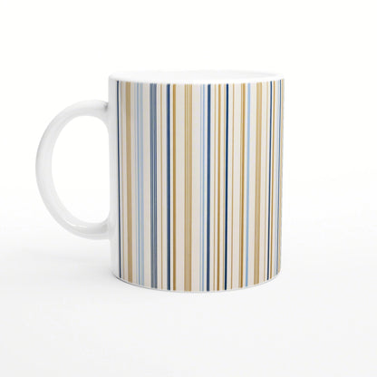White ceramic mug with blue and gold vertical stripes; product mockup for online shop.
