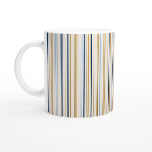 White ceramic mug with blue and gold vertical stripes; product mockup for online shop.