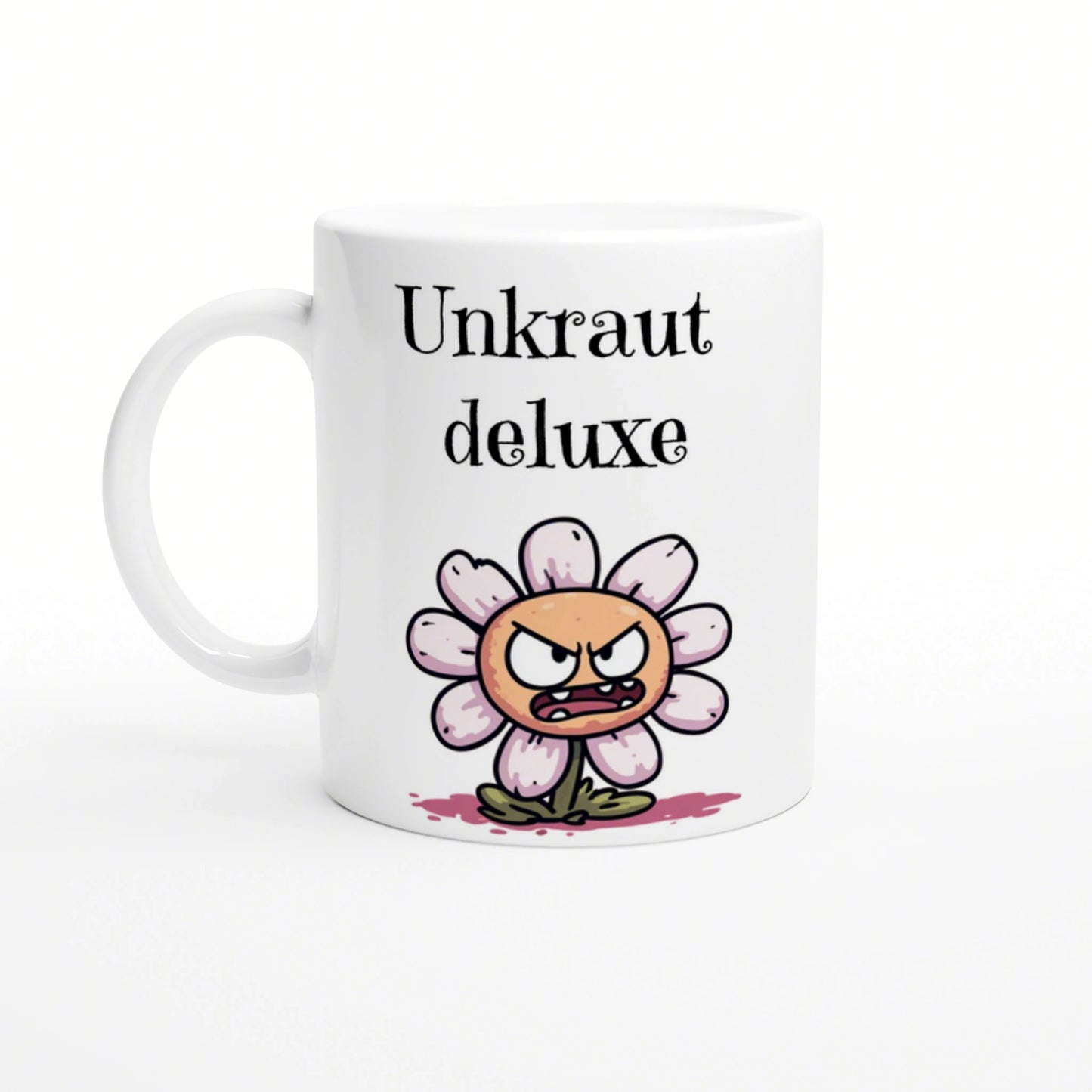 White ceramic mug featuring a cartoon angry flower with pink petals and the text Unkraut deluxe in black.