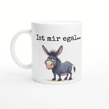 White ceramic mug with a cartoon blue-gray donkey and the phrase 'Ist mir egal...' in black typewriter-style text.