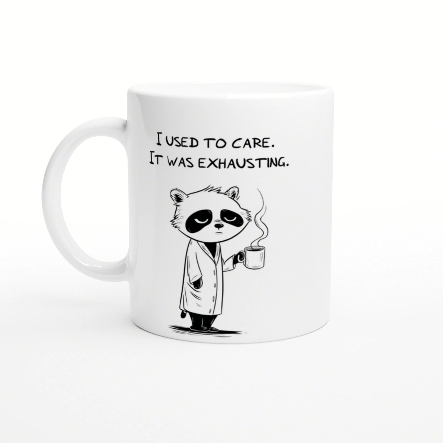 White ceramic mug with a cartoon panda in a robe, holding a steaming mug and the caption 'I used to care. It was exhausting.'