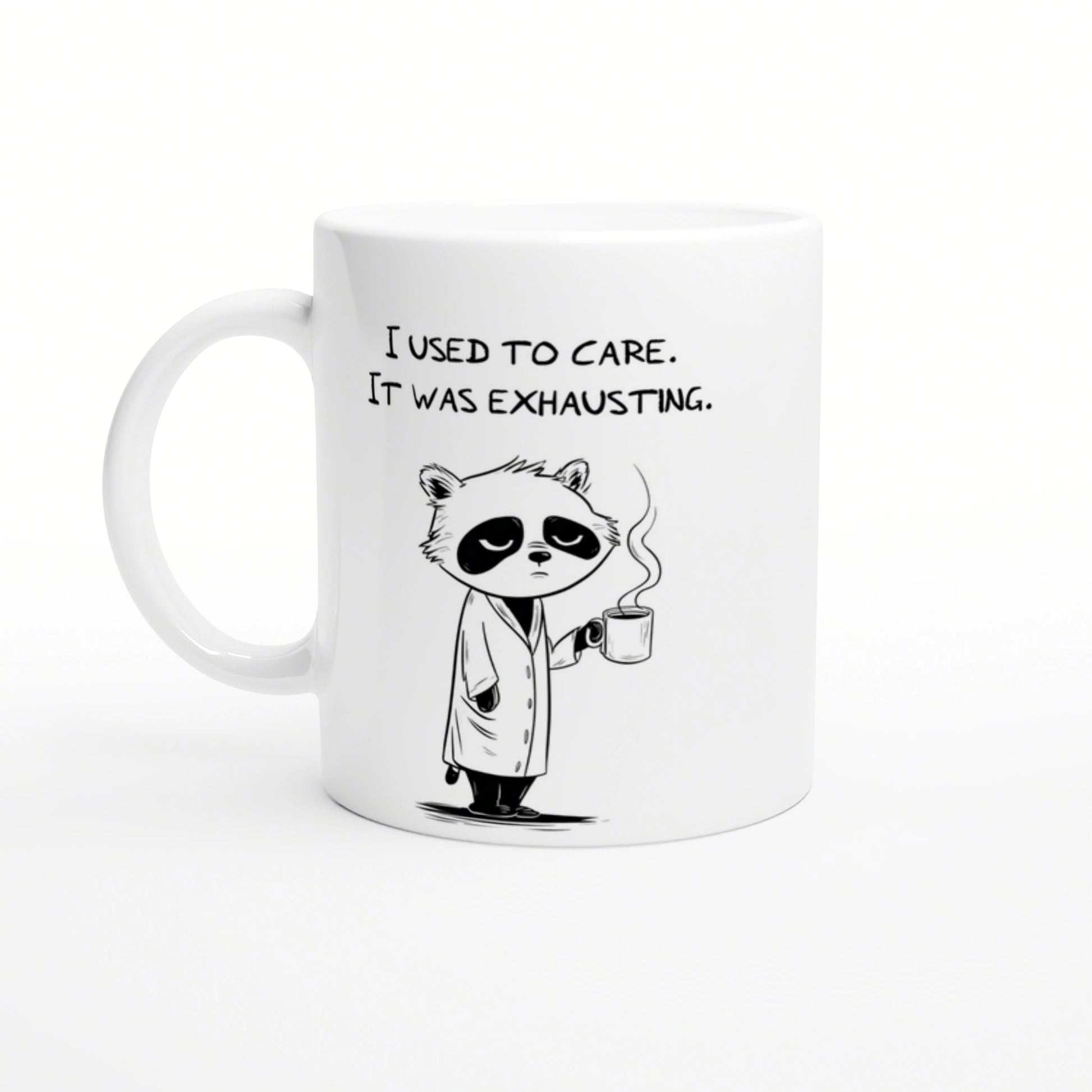 White ceramic mug with a cartoon panda in a robe, holding a steaming mug and the caption 'I used to care. It was exhausting.'