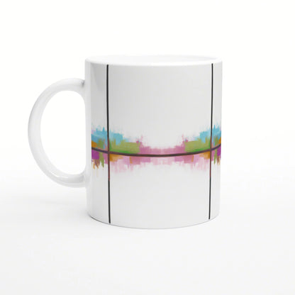 White ceramic mug featuring a colorful abstract band across the middle in pink, blue, green, and yellow, with black lines.