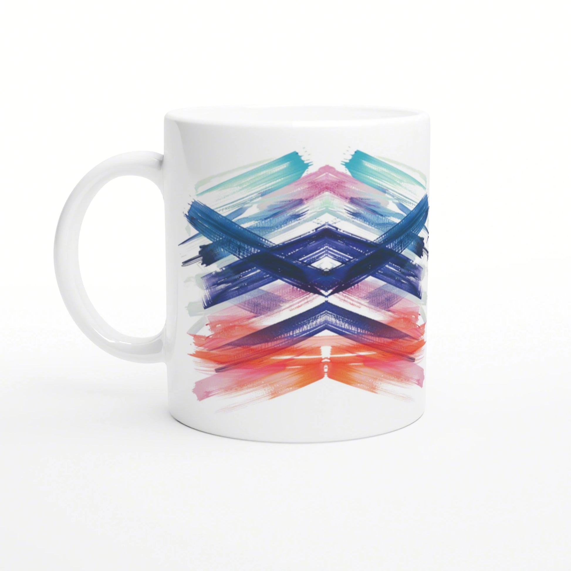 White ceramic mug with a colorful brush-stroke chevron pattern; abstract art design for a product mockup.