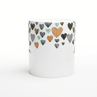 White ceramic mug with a band of colorful, hand-drawn hearts around the rim; product mockup for an online shop.