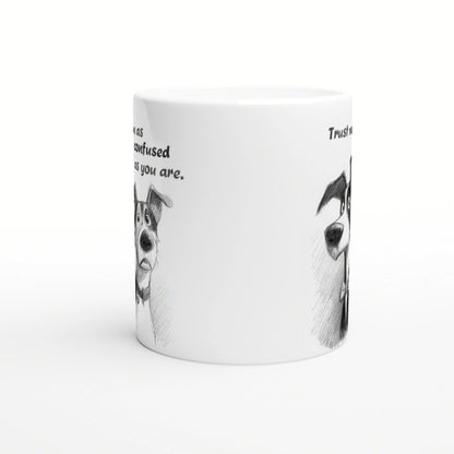 White ceramic mug with a pencil-drawn black-and-white dog and handwritten quotes 'Trust me' and 'as confused as you are'.