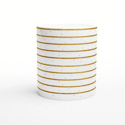 White ceramic mug with horizontal gold glitter stripes and small gold dots; a product mockup for an online shop.