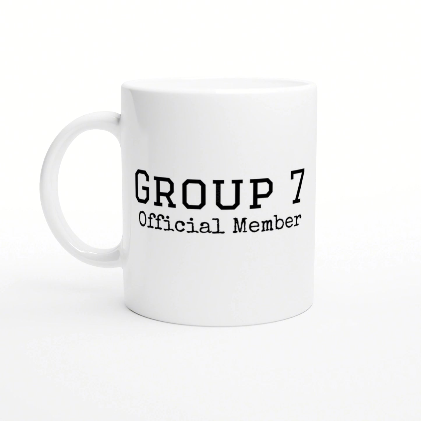 White ceramic mug with bold 'GROUP 7 Official Member' text in a typewriter-style font; product mockup.