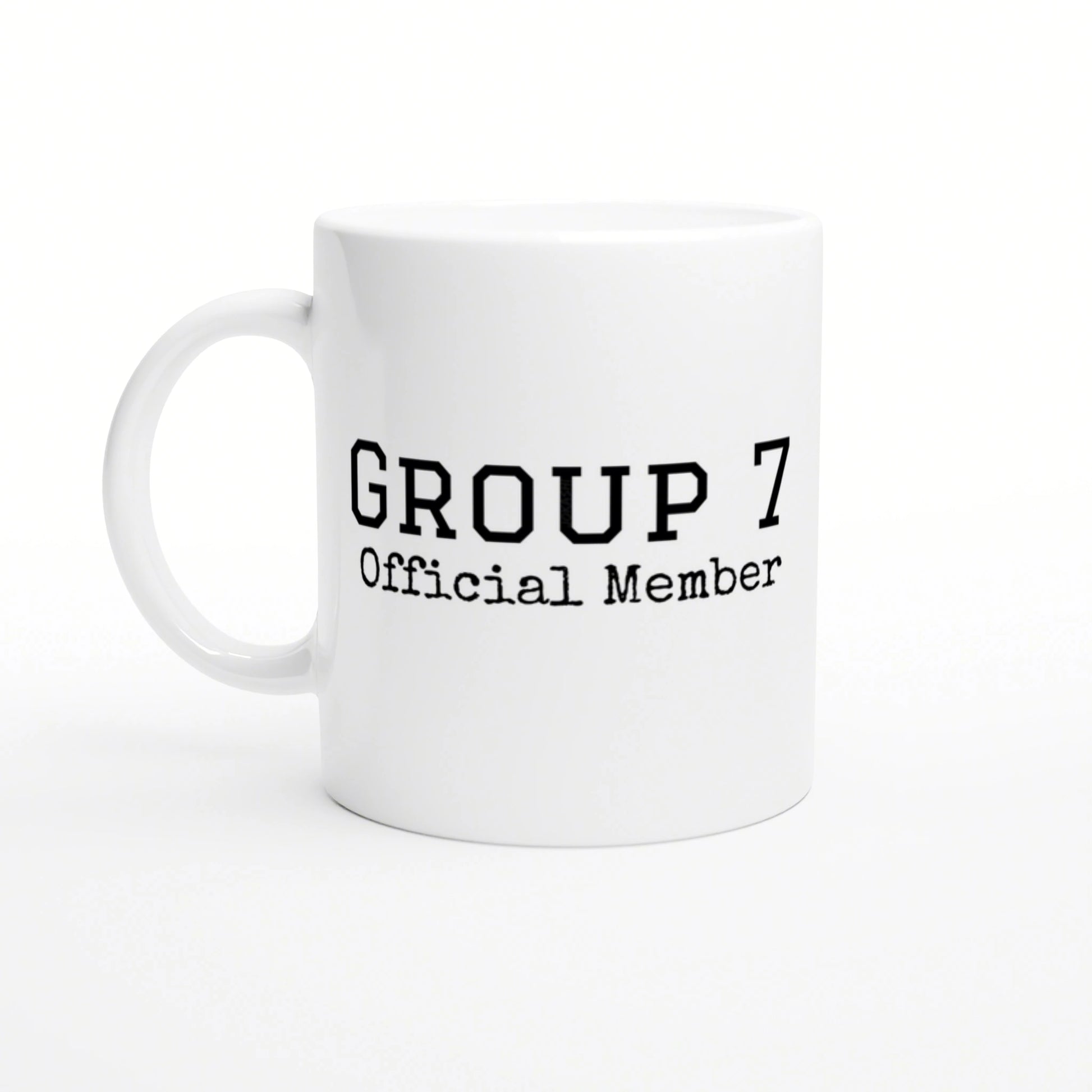 White ceramic mug with bold 'GROUP 7 Official Member' text in a typewriter-style font; product mockup.