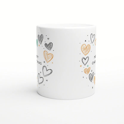 White ceramic mug mockup with hand-drawn hearts in black, orange and teal, tiny stars, and Christmas text wrapping around.