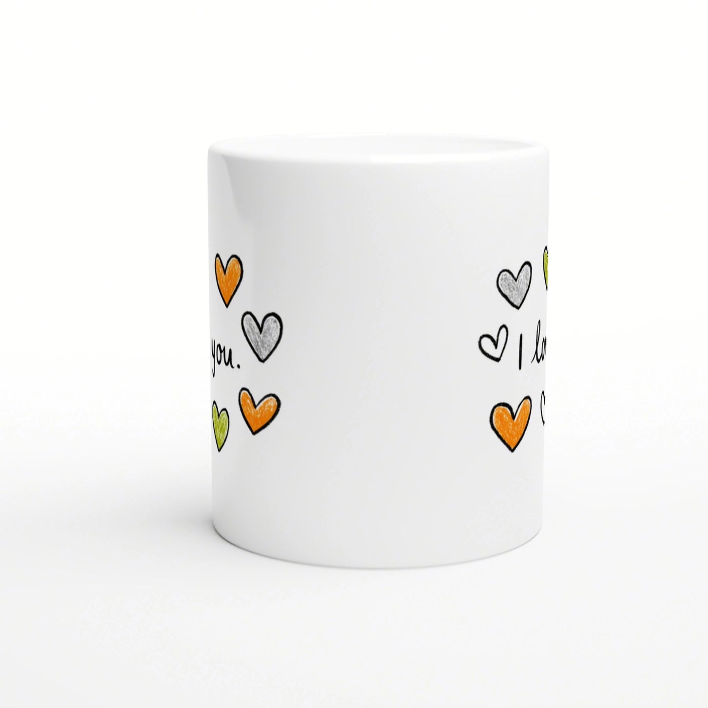 White ceramic mug with a playful, hand-drawn hearts pattern in orange, green and grey around its sides.