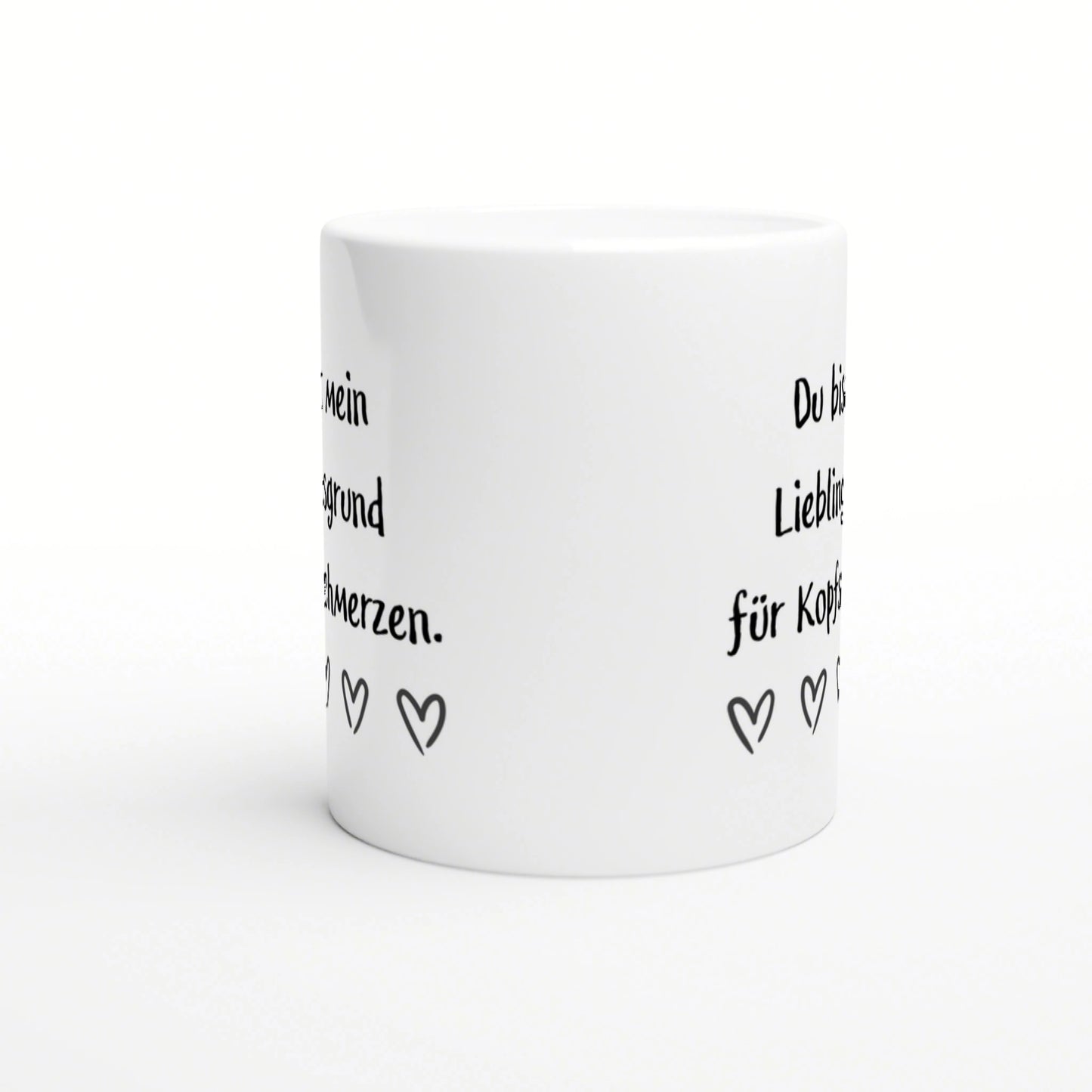 White ceramic mug mockup featuring black handwritten German text and small heart doodles around the side.