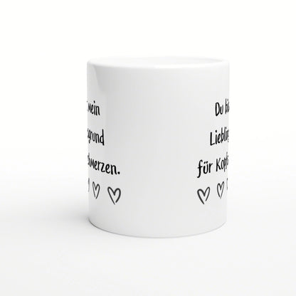 White ceramic mug mockup featuring black handwritten German text and small heart doodles around the side.