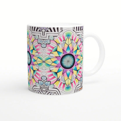 White ceramic mug wrapped in a vivid kaleidoscopic mandala design with neon petals and a blue center.
