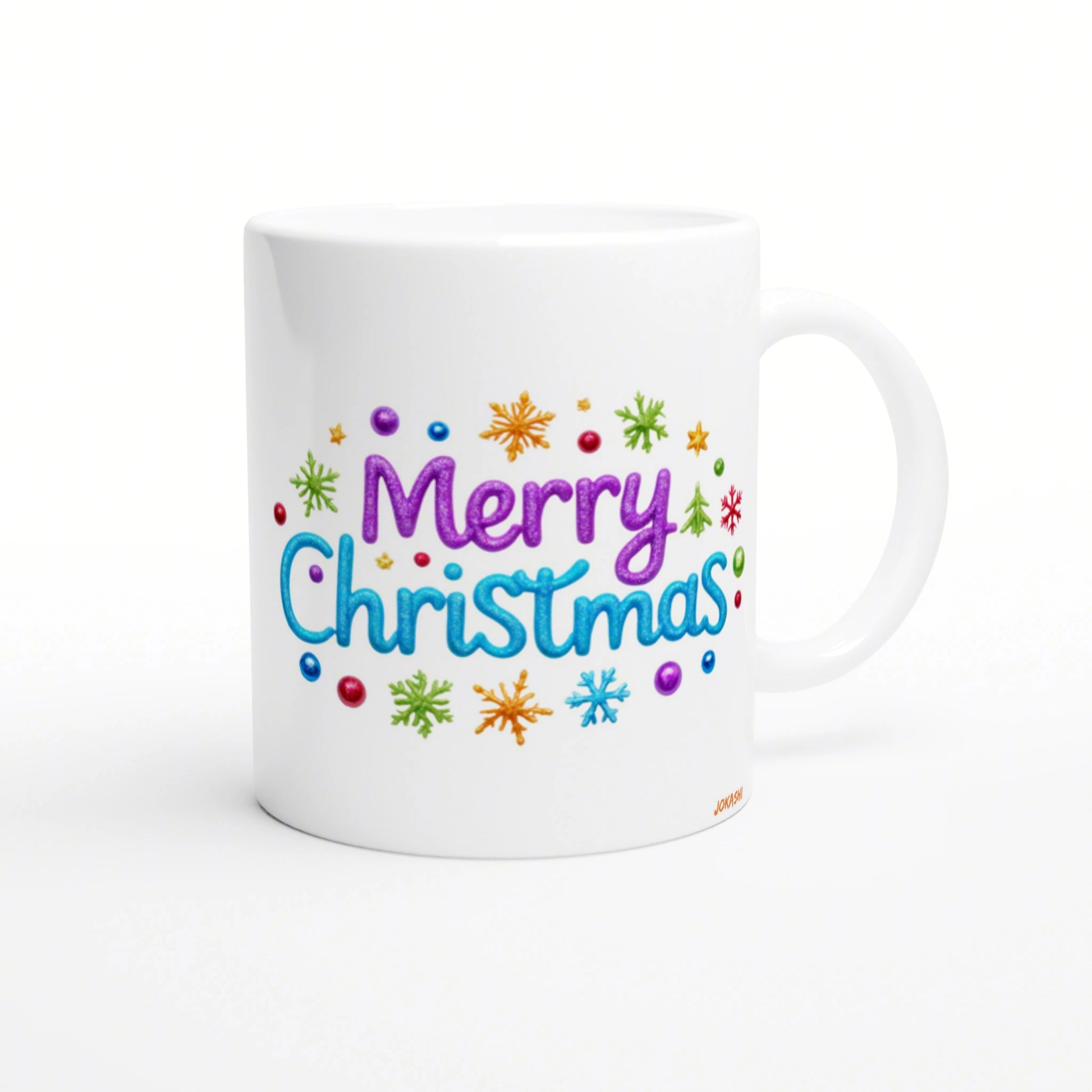 White ceramic mug displaying a colorful 'Merry Christmas' design in purple and blue, with snowflakes and dots.