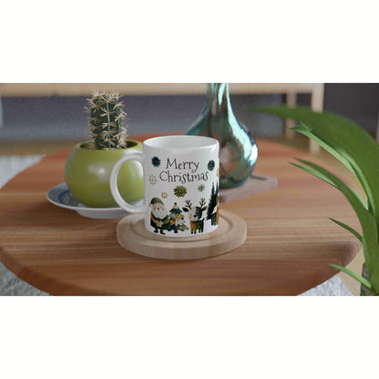 White ceramic mug with 'Merry Christmas' and festive illustrations on a wooden table; product mockup.