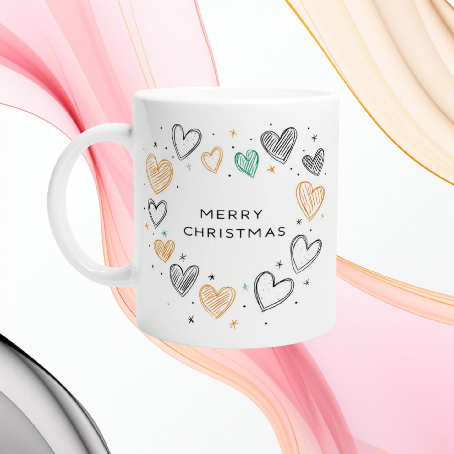 White ceramic mug featuring a 'MERRY CHRISTMAS' slogan with hand-drawn colorful hearts; product mockup for a holiday gift shop.