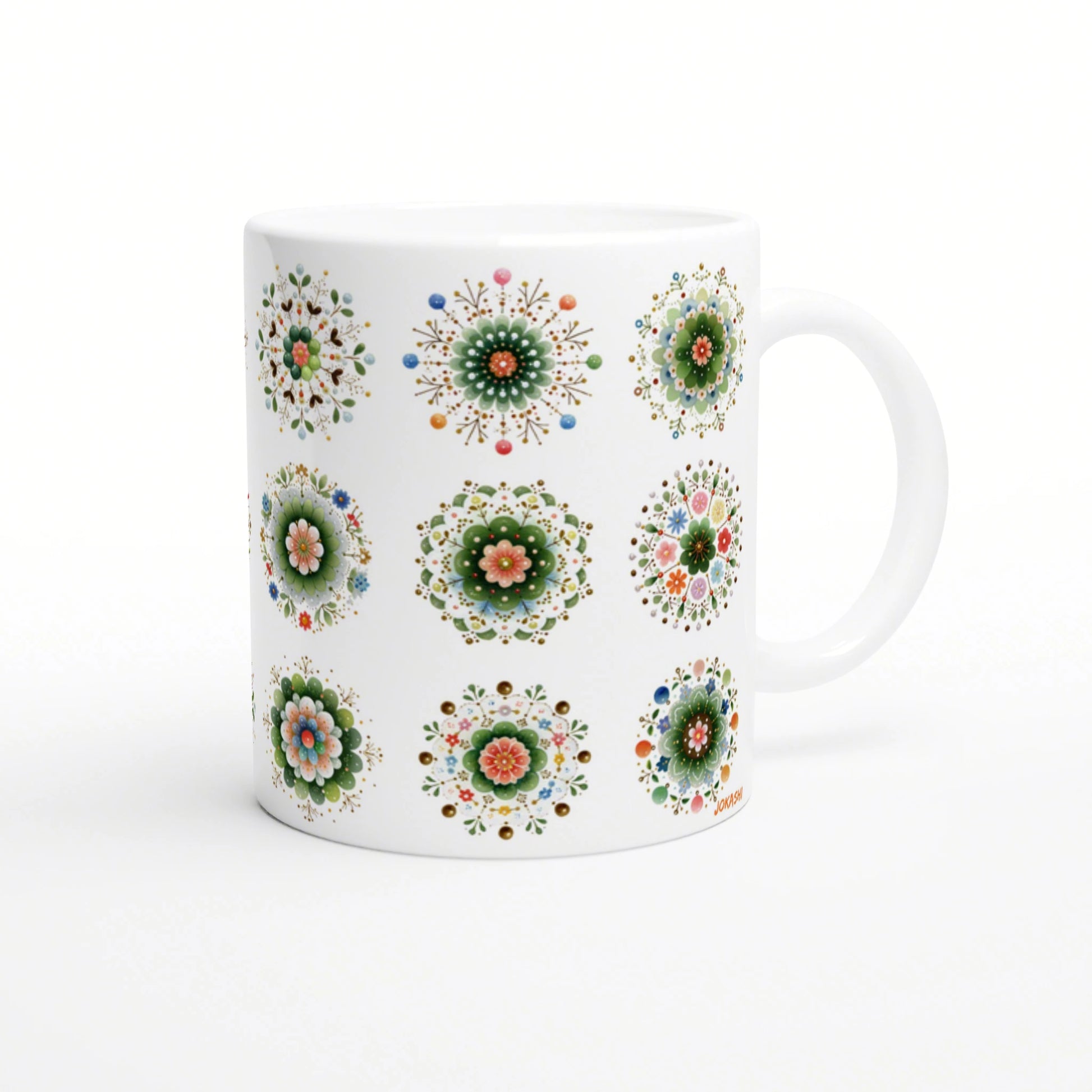White ceramic mug mockup with multiple colorful mandala-style floral patterns around the body.