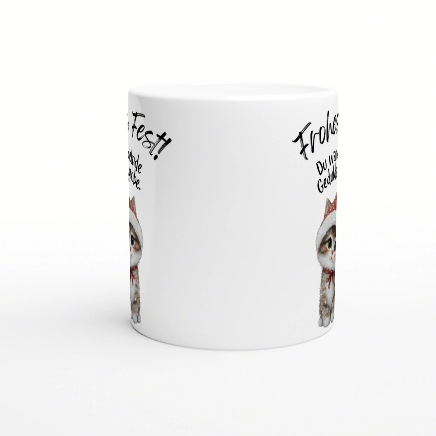 White ceramic mug mockup featuring a cute kitten wearing a Santa hat with handwritten German phrases around the rim.